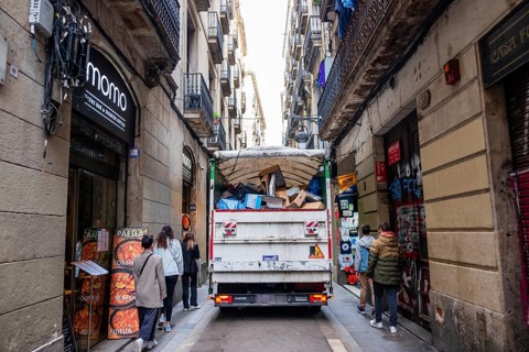 Rubbish lorry in a narrow alley in the Ciutat Vella in Barcelona, Spain