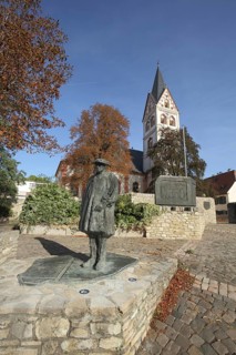 Memorial to Theologian Sebastian Münster 1488-1552, bronze sculpture, modern art, St. Remigius