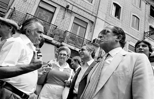 Men and woman talking on a street in Lisbon, Lisbon, Portugal
