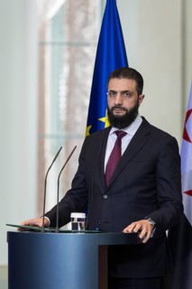 Ahmed al-Sharaa (President of the Syrian Arab Republic) at a joint press conference with Friedrich
