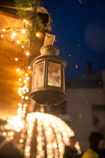 Close-up of an illuminated lantern at night with twinkling fairy lights, Calw Christmas market,