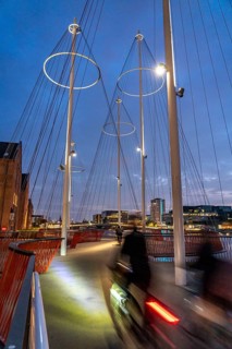 Cyclists on the Cirkelbroen cycle and pedestrian bridge, over the harbour, in the Christianshavens