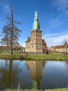 View over moat to historic moated castle from Renaissance Raesfeld Castle in spring, Freiheit