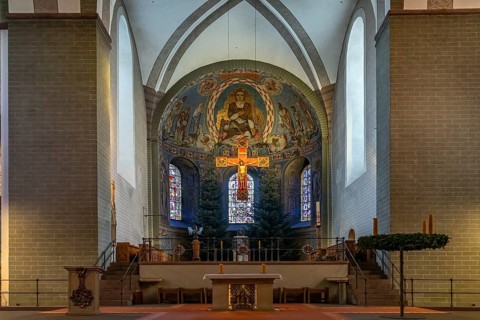 Apse and altar cross in the interior of St. Patrokli Cathedral in Soest, North Rhine-Westphalia,