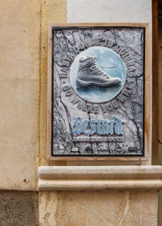 Decorative company sign at a hiking boot shop, Pollenca, Majorca, Spain