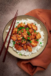 Fried chicken teriyaki with rice, green onion and sesame, homemade, no people