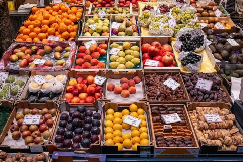 Market stand with local and exotic fruits in the Markthalle Stuttgart, Baden-Württemberg, Germany