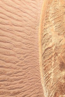 Aerial view capturing the intricate patterns of sand textures in La Puna. The expansive landscape