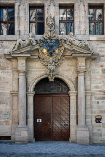 Portal on the west façade of the old town hall in the old town of Nuremberg with imperial eagle and