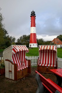 Beach chairs in front of the lighthouse from 1906, Pellworm island, Schleswig-Holstein Wadden Sea