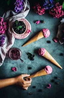 Tempting ice cream cones with creamy Greek yogurt, rich cream, and wild blackberry jam. Perfectly