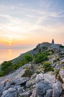 Small fishing village (Lubenice) built on the rocks high above the sea with a view of the sea on a