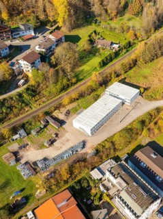 Industrial building between residential buildings and forest, refugee accommodation Beermiß,