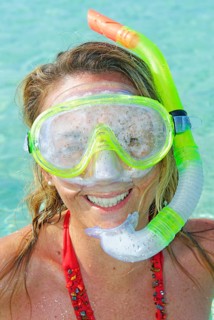 A woman smiling wearing snorkeling gear, Formentera, Baleric Islands, Spain
