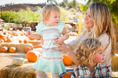 Adorable Young Family Enjoys a Day at the Pumpkin Patch
