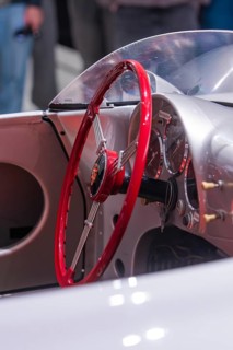 Red steering wheel and cockpit of a classic car with elegant design, Porsche Museum, Stuttgart,