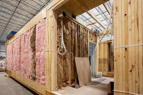 Romulus, Michigan - Workers build apartments in Ginosko Modular 's factory using modular