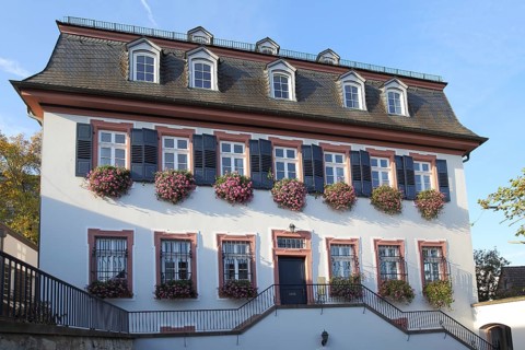 Neo-baroque vicarage, half-timbered house with hipped roof, mansard roof, flower decoration, window