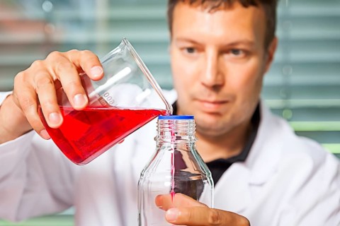 A young laboratory technician experimenting with chemicals, chemist, laboratory, Federal Republic