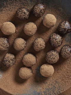 Raw chocolate bliss balls dusted with cacao