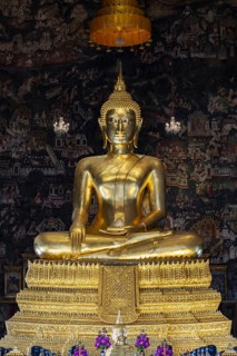 Golden Buddha statue, Phra Buddha Trilokachet, surrounded by exquisite murals, interior view of the