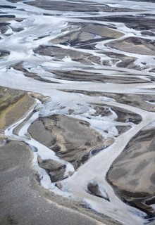 Detail, structure, river course in a gravel bed with black sand, meandering river, Dímonarhellir,