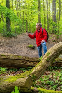 Symbolic image Hiking with smartphone and hiking app, navigation on hiking trails, digital hiking