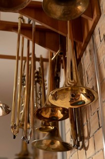 Golden trombones hanging on a wall, Magdeburg, Saxony-Anhalt, Germany