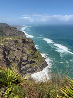 Breathtaking cliffs overlooking the turquoise blue sea and wild vegetation at Mercer Bay Loop Walk