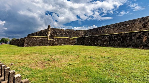 Extensive fortress area with stone walls under blue skies, The fortress of Galle in Sri Lanka