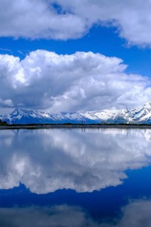 Mountain lake with alpine panorama, snow pond Finkenberg, Penken, Mayrhofen, Zillertal, Tyrol,