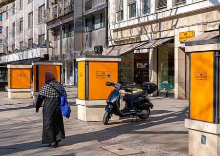 The typical and partly historic display cases for advertising along Boulevard Kurfürstendamm,