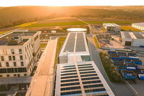 Large solar panels on modern buildings with views of landscape and sun, new hospital at the Verbund