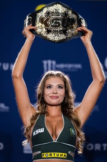 LUBIN, POLAND - NOVEMBER 5, 2022. Beautifull hostess presents KSW (mixed martial arts) belt, during