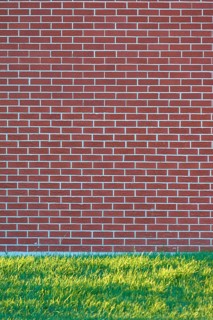 A brick wall with a meadow in front of it, Ontario, Canada