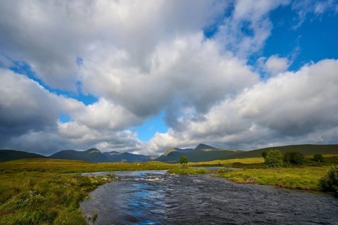 Cloudy sky over river and hills in natural setting, Rannoch Moor, Bridge of Orchy, Scotland, United