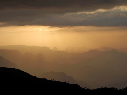 Peaceful sunset over vast mountain silhouettes and dramatic lighting, Simien National Park,