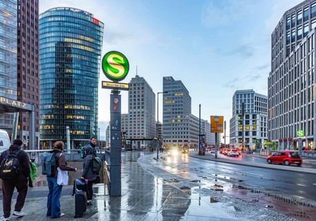 Potsdamer Platz Berlin in the evening with traffic on the streets. When it rains, the skyscrapers