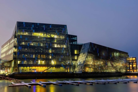 Back of Harpa concert hall, Tónlistar- og ráðstefnuhúsið í Reykjavík, boat dock, blue hour, winter,