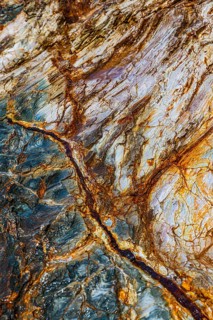 Mineralised rocks on Topinetti beach, near Rio Marina, Elba Island, Tuscan Archipelago National