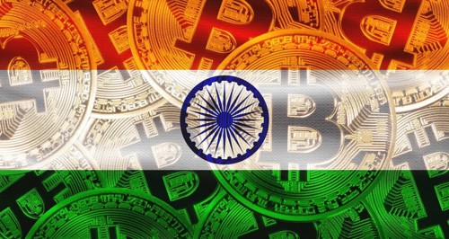 Bitcoins on India flag background. Golden bitcoin coins on India flag background