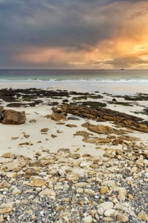 Coastline, rocks and sandy beach, dramatic evening sky, Sennen Cove, Whitesand Bay, Cornwall,