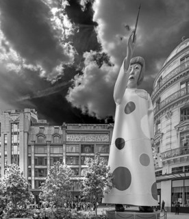 Gigantic figure of Japanese artist Yayoi Kusama pointing at Louis Vuitton department store, black