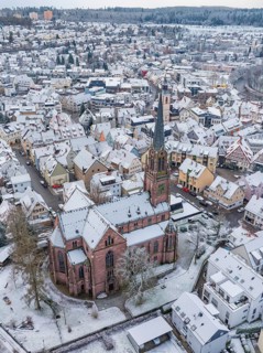 Snow-covered town with a church in the centre and snow-covered roofs, Nagold, Black Forest, Germany