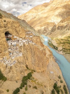 Phugtal Monastery clings to the rugged cliffside of the Lungnak Valley in Ladakh, India. Nestled in