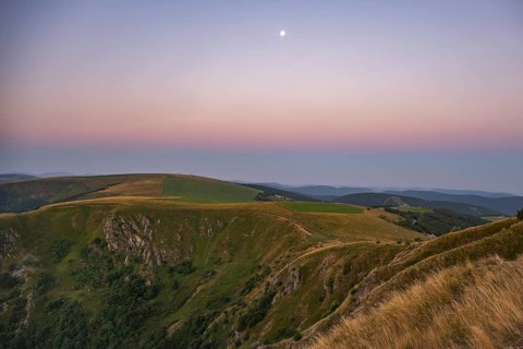 Sunrise mith the moon at Mount Hohneck in the Vosges Mountains, France