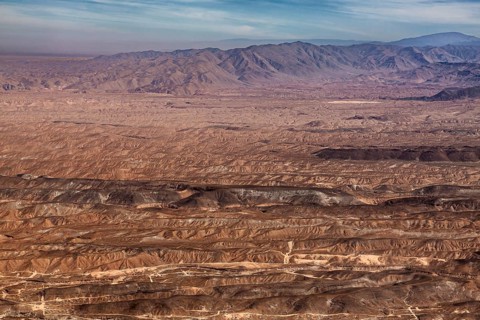 Barren desert landscape with rolling hills and wide horizons, the landscape and desert near Nasca