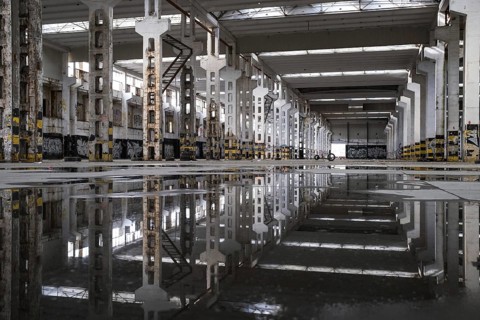 LUBIN, POLAND - MARCH 15, 2023.The ruin of a warehouse with puddles on the floor