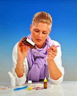 A blonde woman, 25 years old, taking medication for a cold Studio shot, Lower Saxony, Federal