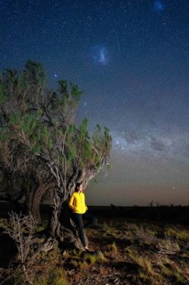 Young woman marvels at the stars of the Milky Way, Tres Cerros, Santa Cruz, Argentina